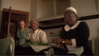 Movie still from “Driving Miss Daisy” (1989), directed by Bruce Beresford – A group of people sitting around a table; Medium shot, Low angle