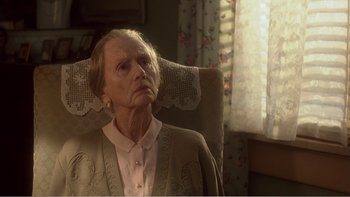 Movie still from “Driving Miss Daisy” (1989), directed by Bruce Beresford – An older woman sitting in a chair looking up; Close Up shot, High angle