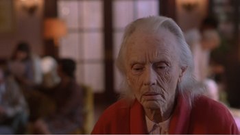 Movie still from “Driving Miss Daisy” (1989), directed by Bruce Beresford – An old woman with white hair sitting in a room; Close Up shot, Over the shoulder angle