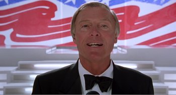 Movie still from “Drop Dead Gorgeous” (1999), directed by Michael Patrick Jann – An older man in a suit and bow tie; Close Up shot, Low angle