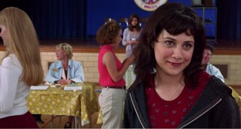 Movie still from “Drop Dead Gorgeous” (1999), directed by Michael Patrick Jann – A group of women standing in front of a table; Close Up shot, Over the shoulder angle