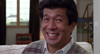 Movie still from “Drop Dead Gorgeous” (1999), directed by Michael Patrick Jann – A person wearing a sweater smiling; Close Up shot, Low angle