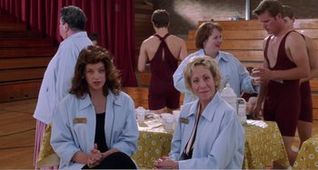 Movie still from “Drop Dead Gorgeous” (1999), directed by Michael Patrick Jann – A group of women sitting next to each other in a room; Medium shot, Over the shoulder angle