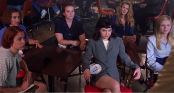 Movie still from “Drop Dead Gorgeous” (1999), directed by Michael Patrick Jann – A group of women sitting around a table; Medium shot, High angle