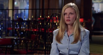 Movie still from “Drop Dead Gorgeous” (1999), directed by Michael Patrick Jann – A woman with long blonde hair wearing a blue shirt; Medium shot, Low angle