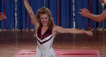 Movie still from “Drop Dead Gorgeous” (1999), directed by Michael Patrick Jann – A woman in a red and white dress on a dance floor; Medium shot, Low angle