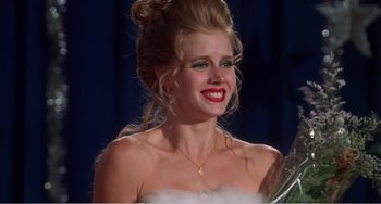 Movie still from “Drop Dead Gorgeous” (1999), directed by Michael Patrick Jann – A person wearing a white dress; Close Up shot, Over the shoulder angle
