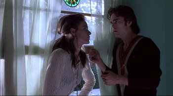 Movie still from “Drugstore Cowboy” (1989), directed by Gus Van Sant – A man and a woman standing next to each other; Medium shot, Low angle