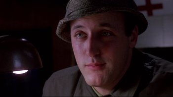 Movie still from “Drugstore Cowboy” (1989), directed by Gus Van Sant – A person wearing a hat; Close Up shot, Low angle