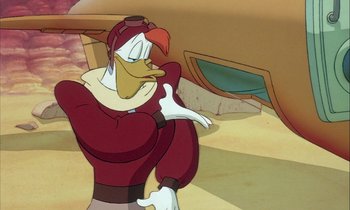 Movie still from “DuckTales the Movie: Treasure of the Lost Lamp” (1990), directed by Bob Hathcock – A cartoon of a goofy character in a red outfit; Medium shot, Low angle