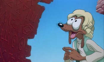 Movie still from “DuckTales the Movie: Treasure of the Lost Lamp” (1990), directed by Bob Hathcock – A goofy dog is looking up at the sky; Close Up shot, Over the shoulder angle
