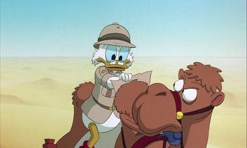 Movie still from “DuckTales the Movie: Treasure of the Lost Lamp” (1990), directed by Bob Hathcock – A cartoon of donald duck riding on a horse; Close Up shot, Low angle