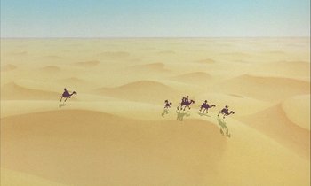 Movie still from “DuckTales the Movie: Treasure of the Lost Lamp” (1990), directed by Bob Hathcock – A group of people riding horses across a desert; Extreme Wide shot, Low angle