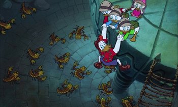 Movie still from “DuckTales the Movie: Treasure of the Lost Lamp” (1990), directed by Bob Hathcock – A group of cartoon characters sitting on top of a brick floor; Wide shot, Overhead angle