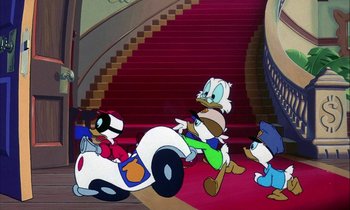 Movie still from “DuckTales the Movie: Treasure of the Lost Lamp” (1990), directed by Bob Hathcock – A group of cartoon characters riding down a red staircase; Wide shot, High angle