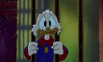Movie still from “DuckTales the Movie: Treasure of the Lost Lamp” (1990), directed by Bob Hathcock – A cartoon character in a jail cell; Close Up shot, High angle