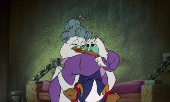 Movie still from “DuckTales the Movie: Treasure of the Lost Lamp” (1990), directed by Bob Hathcock – A cartoon character with a chain around it's neck; Medium shot, Over the shoulder angle