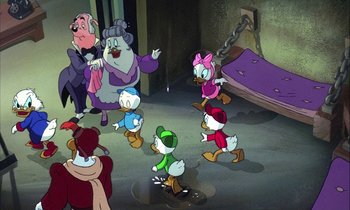 Movie still from “DuckTales the Movie: Treasure of the Lost Lamp” (1990), directed by Bob Hathcock – A group of cartoon characters are in a puddle of water; Wide shot, High angle