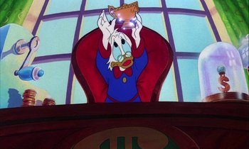 Movie still from “DuckTales the Movie: Treasure of the Lost Lamp” (1990), directed by Bob Hathcock – A stained glass window of a cartoon character with a cat on his head; Medium shot, Low angle