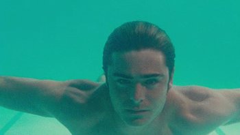 Movie still from “The Paperboy” (2012), directed by Lee Daniels – A man is swimming in a pool of water; Close Up shot, Low angle