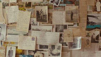 Movie still from “The Paperboy” (2012), directed by Lee Daniels – A bunch of old photographs and letters on a wall; Extreme Close Up shot, Overhead angle