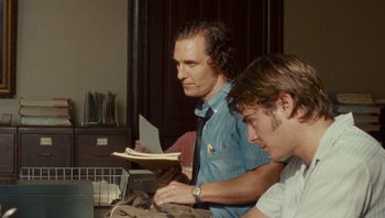 Movie still from “The Paperboy” (2012), directed by Lee Daniels – Two men sitting in front of a computer; Medium shot, Over the shoulder angle