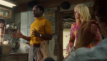 Movie still from “The Paperboy” (2012), directed by Lee Daniels – A man and a woman standing next to each other in a room; Medium shot, Low angle