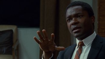 Movie still from “The Paperboy” (2012), directed by Lee Daniels – A man in a suit and a tie; Close Up shot, Over the shoulder angle