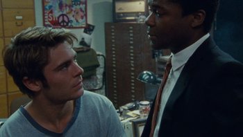 Movie still from “The Paperboy” (2012), directed by Lee Daniels – Two men are talking in a room; Close Up shot, Over the shoulder angle