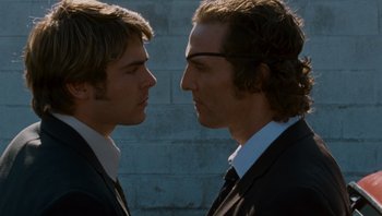 Movie still from “The Paperboy” (2012), directed by Lee Daniels – Two men in business suits face each other; Close Up shot, Over the shoulder angle