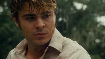 Movie still from “The Paperboy” (2012), directed by Lee Daniels – A person with a shirt on; Close Up shot, Over the shoulder angle