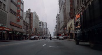 Movie still from “Duel” (1971), directed by Steven Spielberg – A city street filled with lots of traffic; Extreme Wide shot, High angle