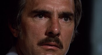 Movie still from “Duel” (1971), directed by Steven Spielberg – A man with a mustache; Extreme Close Up shot, Low angle
