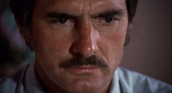 Movie still from “Duel” (1971), directed by Steven Spielberg – A person with a mustache; Close Up shot, High angle