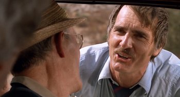 Movie still from “Duel” (1971), directed by Steven Spielberg – Two men are talking in the back of a car; Close Up shot, Over the shoulder angle