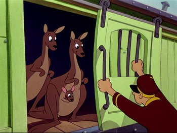 Movie still from “Dumbo” (1941), directed by Ben Sharpsteen – A cartoon picture of a man looking at three kangaroos in a cage; Medium shot, Low angle