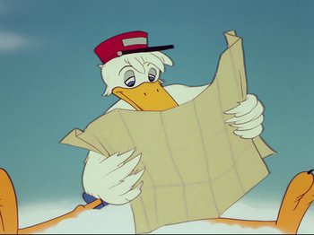 Movie still from “Dumbo” (1941), directed by Ben Sharpsteen – A cartoon duck holding a newspaper in his hands; Close Up shot, High angle
