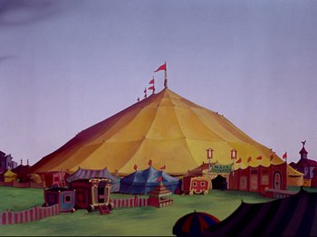 Movie still from “Dumbo” (1941), directed by Ben Sharpsteen – A large yellow tent with a red flag on the top of it; Extreme Wide shot, Low angle