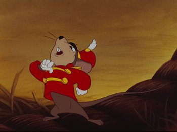 Movie still from “Dumbo” (1941), directed by Ben Sharpsteen – A picture of a mouse in a red outfit; Medium shot, Low angle