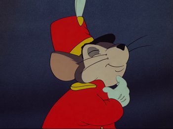 Movie still from “Dumbo” (1941), directed by Ben Sharpsteen – A cartoon of a mouse wearing a red uniform; Close Up shot, Low angle