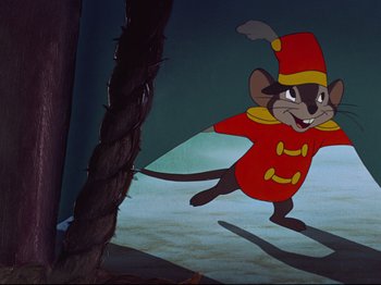 Movie still from “Dumbo” (1941), directed by Ben Sharpsteen – A painting of a mouse dressed in a red outfit; Wide shot, Low angle