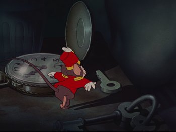 Movie still from “Dumbo” (1941), directed by Ben Sharpsteen – A cartoon of a goofy character in a red outfit; Medium shot, High angle