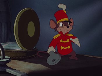 Movie still from “Dumbo” (1941), directed by Ben Sharpsteen – A mouse dressed in a red uniform and a red hat; Medium shot, Low angle
