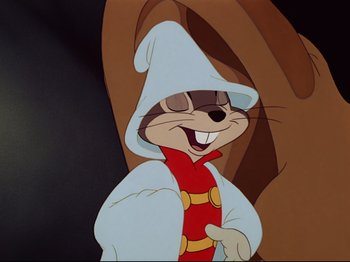 Movie still from “Dumbo” (1941), directed by Ben Sharpsteen – A picture of a cartoon character with a hat and jacket on; Medium shot, High angle