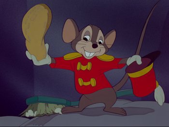 Movie still from “Dumbo” (1941), directed by Ben Sharpsteen – A cartoon of a mouse holding a piece of bread; Medium shot, Low angle