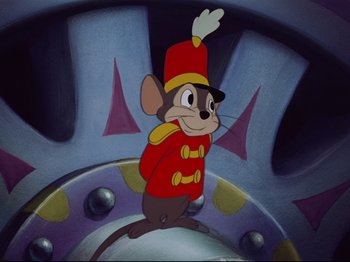 Movie still from “Dumbo” (1941), directed by Ben Sharpsteen – A mouse wearing a red uniform and a red hat; Medium shot, Low angle
