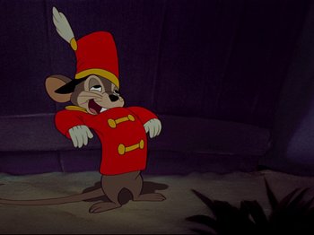 Movie still from “Dumbo” (1941), directed by Ben Sharpsteen – A mouse in a red outfit is standing up; Medium shot, Low angle
