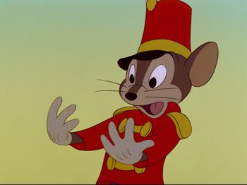 Movie still from “Dumbo” (1941), directed by Ben Sharpsteen – A cartoon of a mouse in a red uniform; Close Up shot, Low angle