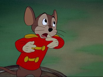 Movie still from “Dumbo” (1941), directed by Ben Sharpsteen – A mouse in a red jacket is pointing to the side; Close Up shot, High angle