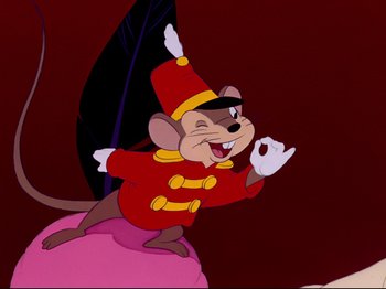 Movie still from “Dumbo” (1941), directed by Ben Sharpsteen – A mouse dressed in a red uniform and a red hat; Medium shot, Low angle